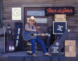 Cover photo of Rambler Rick’s “Tour Du Jour” album at Rambler Ranch/Airflyte Records office, Burlington, VT (1989) Norcross-Tour-Du-Jour-cover-