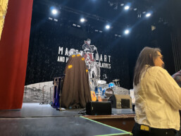 Rick's Mighty Pickle Object D'Art under wraps on stage prior to Mart's presentation to Rick, April 2024